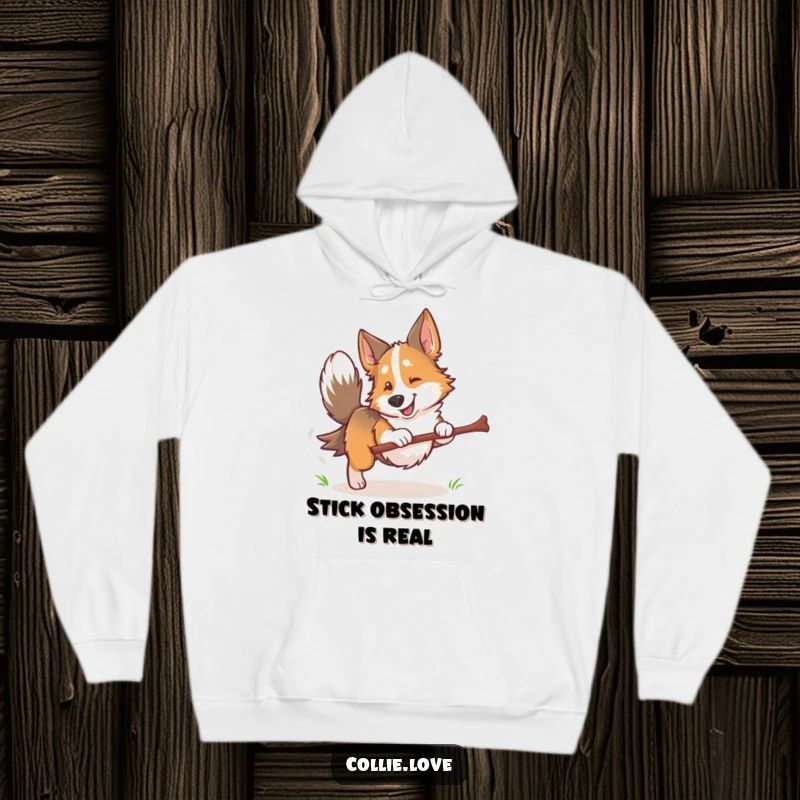 Funny Collie dog hoodie, tail wagging, retrieving a stick with intense focus and happy dog energy, perfect for outdoor lovers.