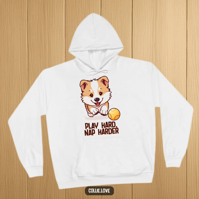 Funny Collie Puppy Hoodie: A Kawaii Collie puppy intensely chases a bouncing ball, offering warmth and adorable charm.