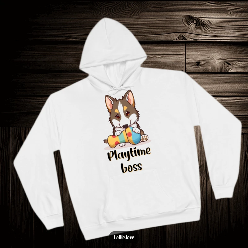 Funny Collie hoodie, playfully nudging a bright dog toy with its nose, a hilarious depiction of canine engagement, great funny gift.